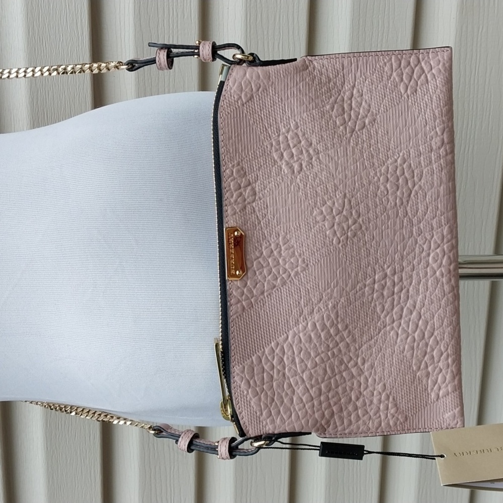 BURBERRY PEYTON EMBOSSED CHECK LEATHER CROSSBODY BAG IN PALE ORCHID